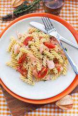 Fusilli pasta with smoked salmon and tomatoes