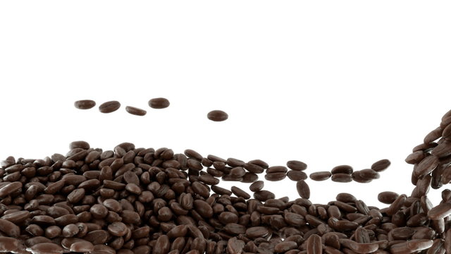 Roasted Coffee beans falling and mixing with slow motion