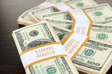 Stacks of money on wooden table