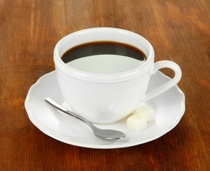 Coffee cup on wooden table close-up