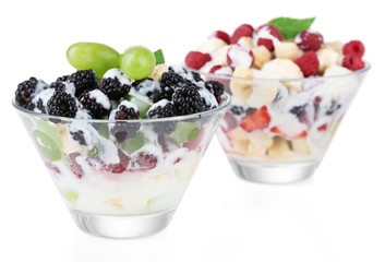 Fruit salad in glass bowls, isolated on white