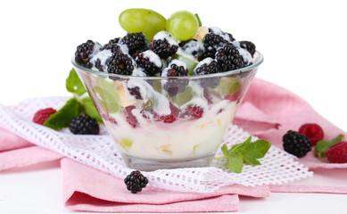 Fruit salad in glass bowl, isolated on white