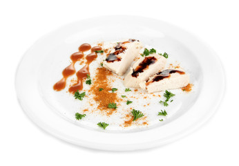 Boiled chicken meat with paprika and sauce, isolated on white