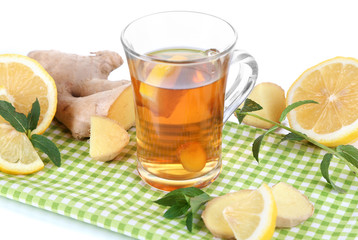 Cup of tea with ginger on napkin isolated on white