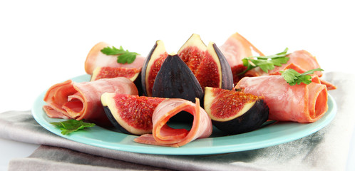 Tasty figs with ham, isolated on white