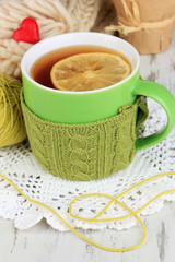 Cup with knitted thing on it close up