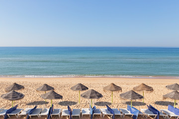 Exotic landscape with umbrellas on the beach near the beach. In