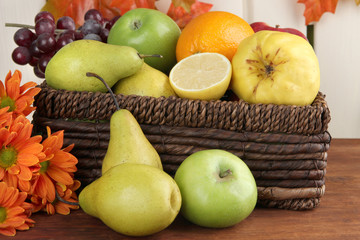 Different fruits with basket and flowers