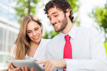 Couple using a digital tablet