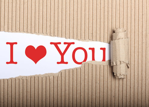 I love you text on paper and torn cardbox