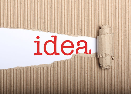 Idea text on paper and torn cardbox