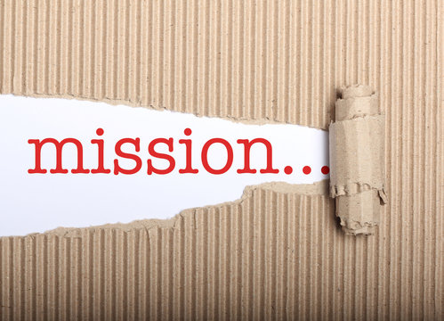 Mission text on paper and torn cardbox