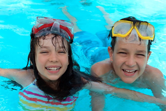Happy kids swimming