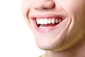 Beautiful wide smile of young man with great healthy white teeth