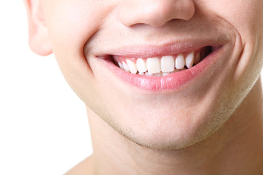 Beautiful wide smile of young man with great healthy white teeth