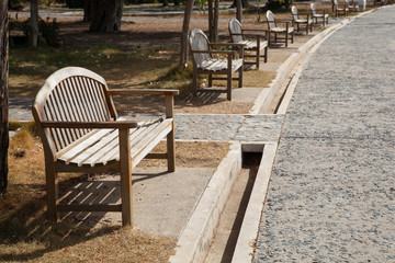 Fototapeta na wymiar Wooden bench located near the corridor.