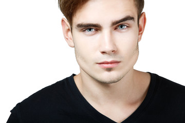 Fototapeta premium Young man handsome face closeup, sexy guy looking at camera over