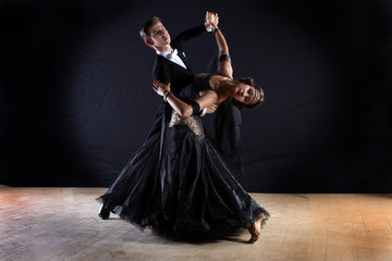 Latino dancers in ballroom isolated on black background