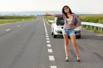 Woman driver hitch-hiking