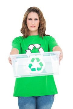 Serious environmental activist holding recycling box