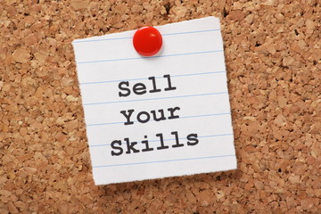 Sell Your Skills paper note on a cork notice board