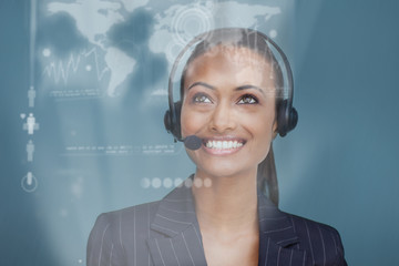 Happy pretty businesswoman looking at futuristic interface holog