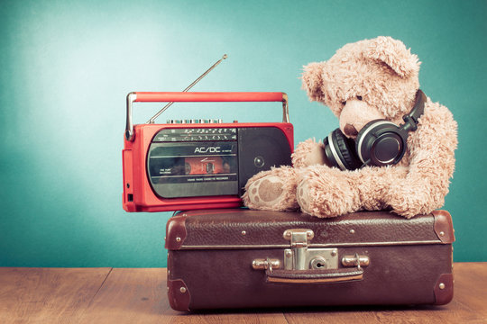 Retro Teddy Bear, old suit case and radio recorder