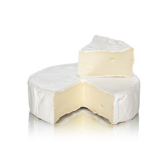 Round camembert cheese with a cut out piece