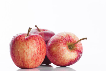 Juicy red apples on white background