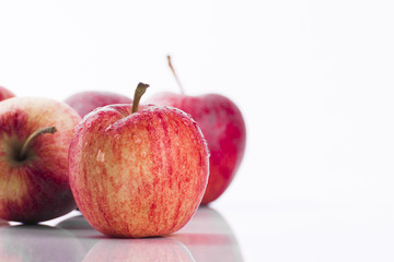 Juicy red apples on white background