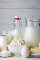 Dairy products on wooden table close-up