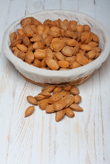 Almonds in shell on wooden table still life