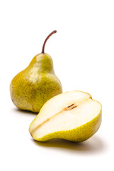 A pear with a slice isolated on white