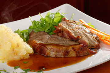 Fried pork chop, mashed potato and vegetable salad
