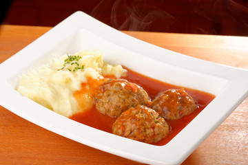 Meat balls with tomato sauce and mashed potato