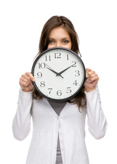 Half-length portrait of woman keeping clock, isolated