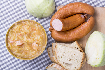 Bigos, sauerkraut and sausage stew with ingredients.