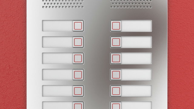 Apartments intercom on red wall