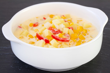 corn chowder in white bowl
