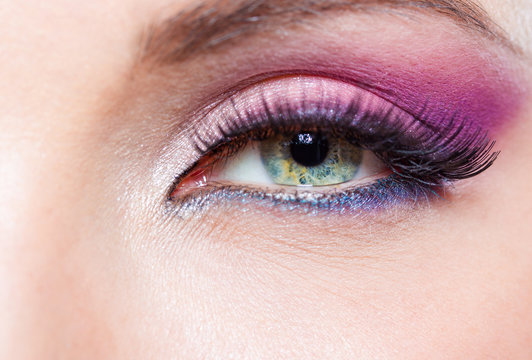Close up of female eye with bright pink make-up