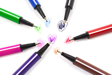 Colorful pens a heart shape.
