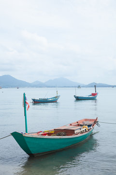 Fishing boats moored at the shore.