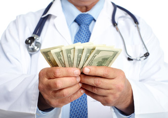 Hands of medical doctor with money.