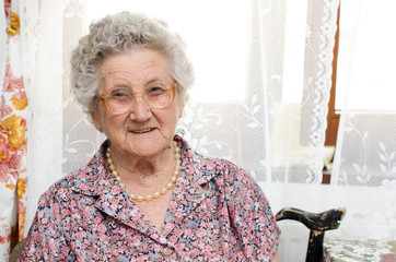 Senior woman portrait in her room