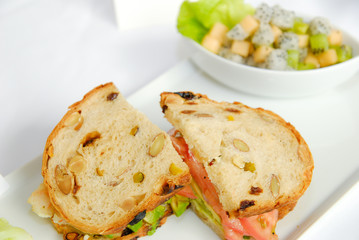 Fresh sandwich with fruit salad
