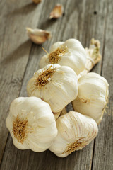 Garlic heads on a wooden table