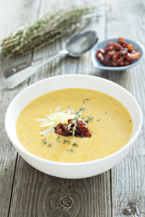 Potato cream soup with bacon and cheese