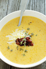 Potato cream soup with bacon and cheese