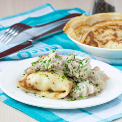 Russian pancakes with chicken and mushrooms champignon