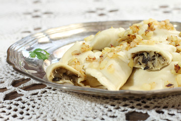 homemade pierogi (ravioli) with mushroom and sauerkraut. 